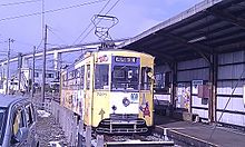 Manyo Line tramcar at Koshinokata Station.jpg